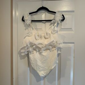 Ruffled White One-Piece Bodysuit